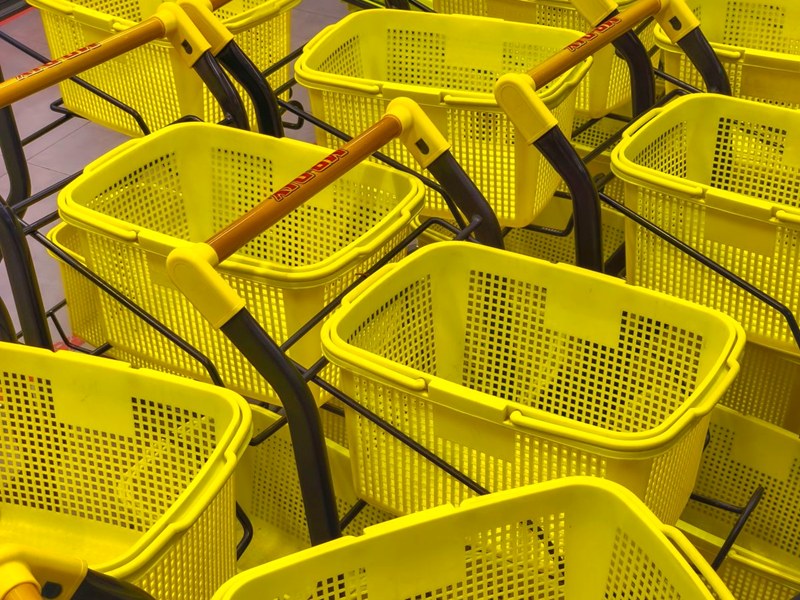 Stacked plastic supermarket shopping baskets